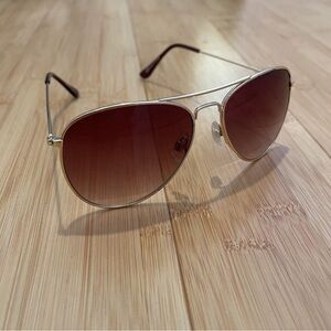 H&M Sunglasses with metal frames and UV-protective, sunset tinted lenses.